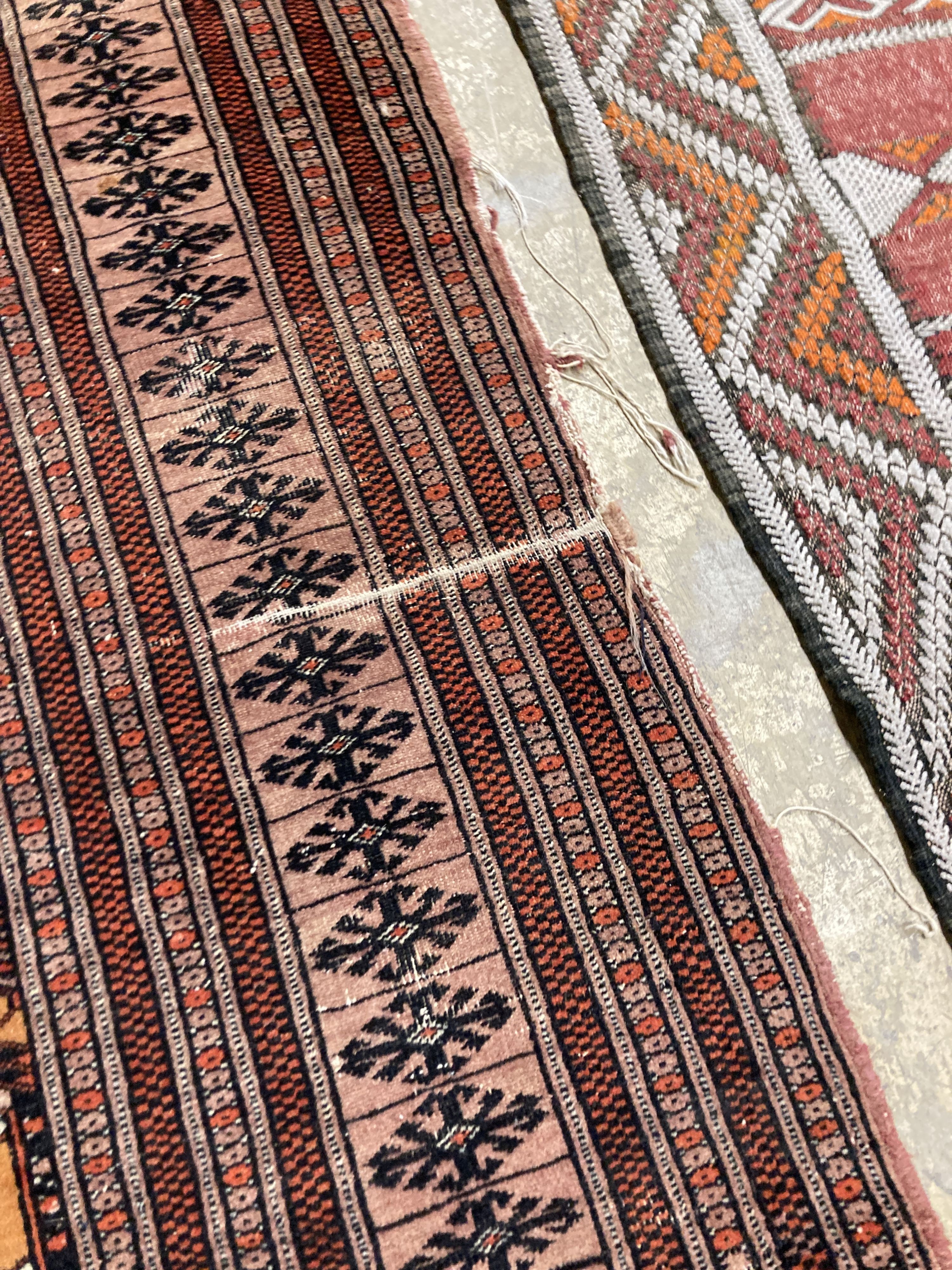 A Bokhara orange ground rug 198 x 125 cms, a smaller Anatolian flat weave rug and Bokhara prayer mat.